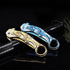 Portable folding knife with gold dragon relief design