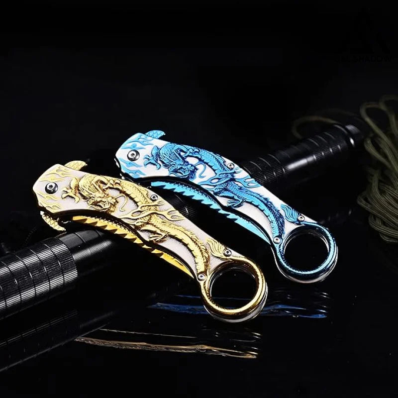 Portable folding knife with gold dragon relief design